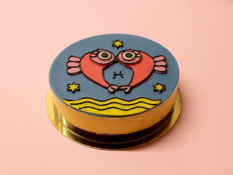 Gâteau d'anniversaire Astro Poisson avec un dessin de l'artiste française Virgen. À commander et personnaliser.